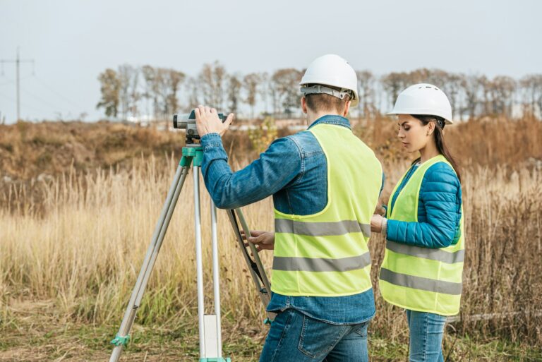 Surveyors working with digital level in field