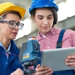 Pretty Surveyors Focused on Work